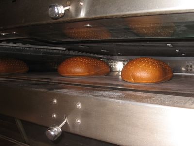two massive rye loaves in the oven